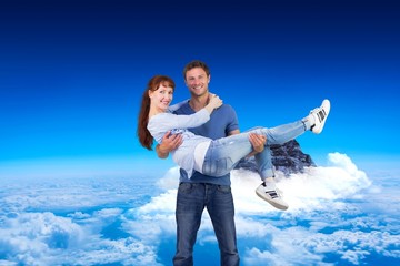 Poster - Composite image of man lifting up his girlfriend
