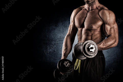 Naklejka na szybę Closeup of a muscular young man lifting weights