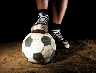 Sticker - Soccer ball on ground on dark background