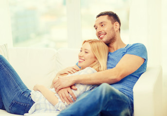 Canvas Print - smiling happy couple at home