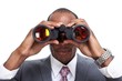 © grinny - African-American businessman with binoculars.