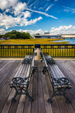 Benches On The Fishing Pier In Charleston, South Carolina.
