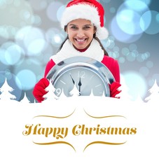 Poster - Composite image of festive brunette holding clock