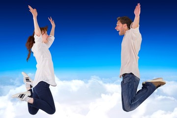 Aufkleber - Composite image of couple jumping in the air