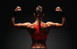 © Restyler - Athletic young woman showing muscles of the back