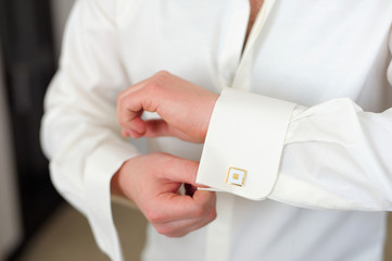 men wear cufflinks on a shirt sleeve