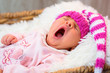 © Patryk Kosmider - Newborn baby girl in pink knitted hat