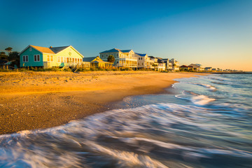 Waves in the Atlantic Ocean and morning light on beachfront home