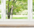 Wooden table over summer window background