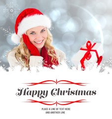 Poster - Composite image of happy festive blonde with gift