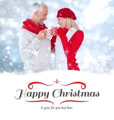 Aufkleber - Composite image of happy winter couple with mugs