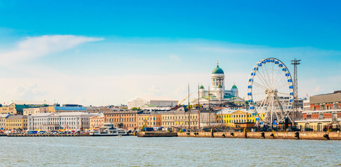 Wall Mural - panorama of embankment in helsinki at summer sunset evening, sun