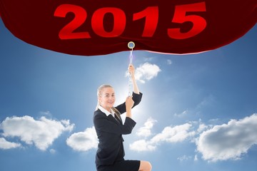 Poster - Composite image of businesswoman pulling a chain