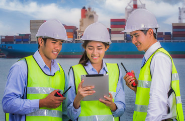 Wall Mural - The engineer working with container Cargo freight ship