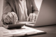 © Nonwarit - Businessman analyzing investment charts with laptop. Accounting