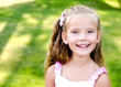 © svetamart - Portrait of adorable smiling little girl in the park