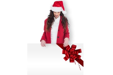 Poster - Composite image of festive brunette showing white poster