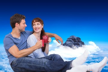 Poster - Composite image of couple having tea on floor