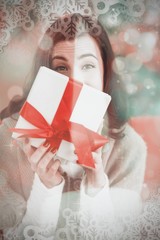 Poster - Composite image of brunette showing gift