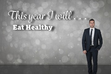 Poster - Composite image of businessman standing with hand in pocket