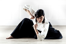 Beautiful Woman Wearing A Hakama Practicing Aikido
