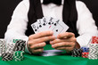 © Syda Productions - poker player with cards and chips at casino