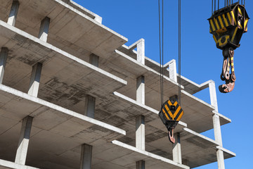 Wall Mural - Crane hooks and new building is under construction