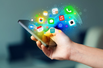 Poster - Hand holding smartphone with colorful app icons