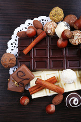 Wall Mural - Bars of white and bitter chocolates with candies, hazelnut and