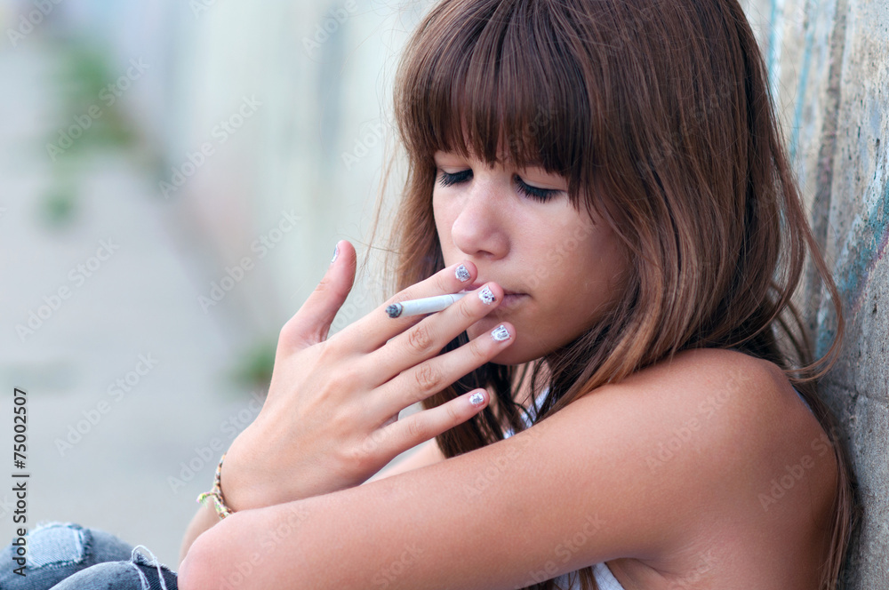 teens smoking cigarettes Teenage girl smoking cigarette Stock Photo