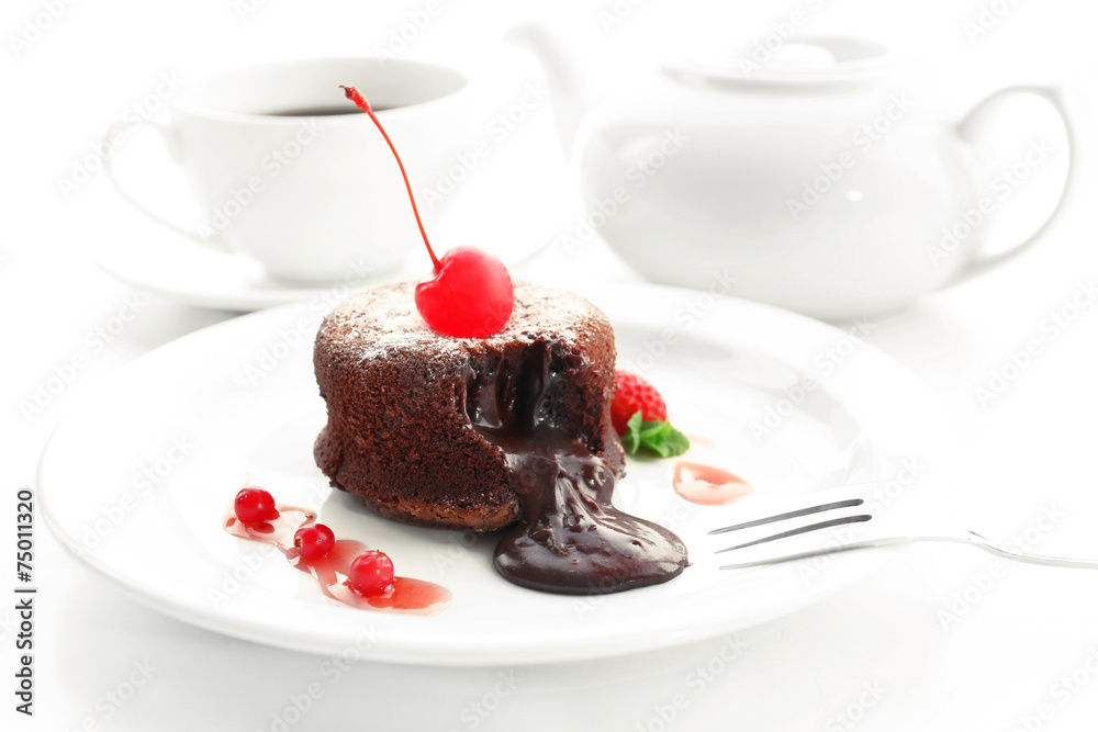 Hot chocolate pudding with fondant centre on plate, close-up