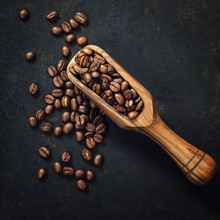 Coffee Beans And An Old Wooden Scoop