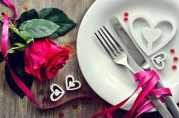 saint valentines's day festive romantic table setting and rose