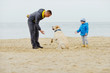 © Elena Stepanova - family with dog on the beach