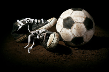 Wall Mural - Soccer ball on ground on dark background