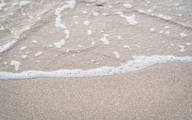 Soft wave of the sea on the sandy beach