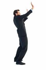 Poster - Focused businessman pushing with hands