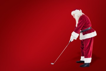 Poster - Composite image of santa claus is playing golf