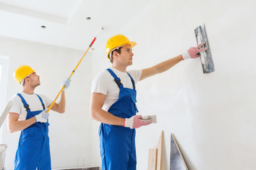 Poster - group of builders with tools indoors