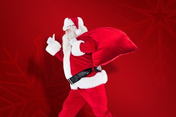 Poster - Composite image of positive santa with a sack and thumbs up