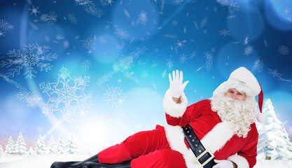 Poster - Composite image of relaxed santa lying and waving