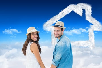 Poster - Happy hipster couple holding hands and smiling at camera