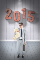 Poster - Composite image of businessman holding teddy bear