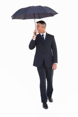 Poster - Happy businessman walking with his umbrella