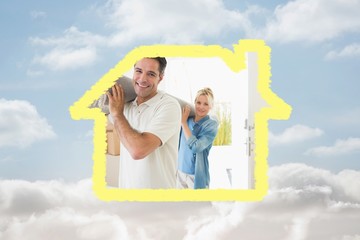 Poster - Couple carrying rolled rug after moving in a house