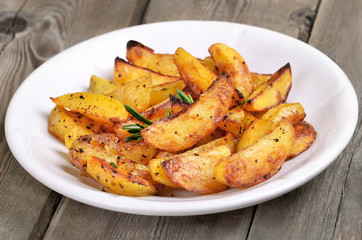 Wall Mural - potato wedges on white plate