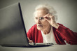 © olly - Confused grandmother using a pc