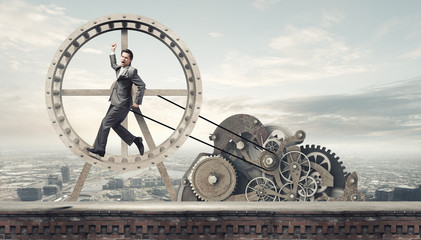 Businessman in wheel