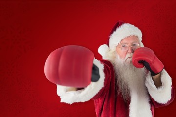 Poster - Composite image of santa claus punches with his right