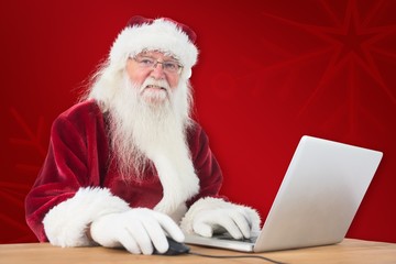 Aufkleber - Composite image of santa surfs on the internet